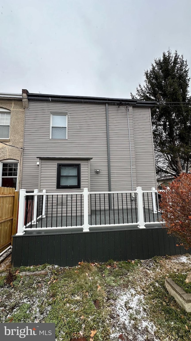 rear view of property with a wooden deck