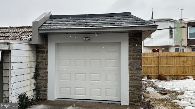 view of snow covered garage