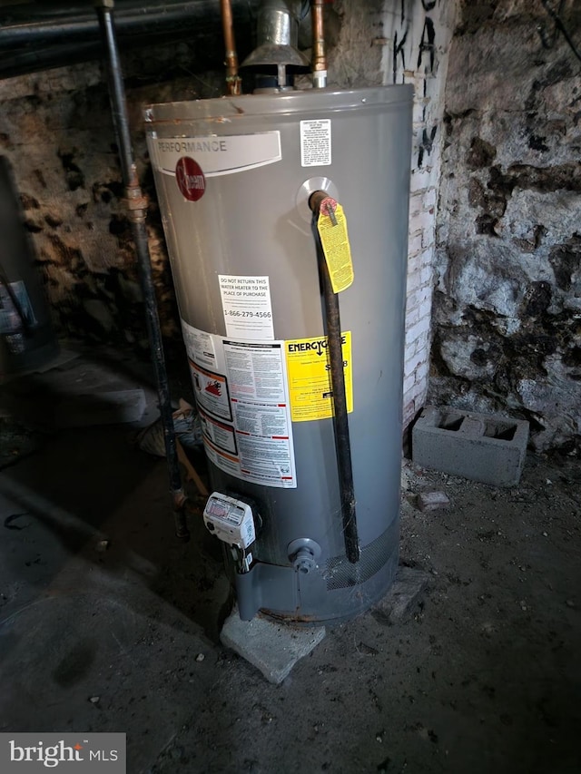 utility room featuring water heater