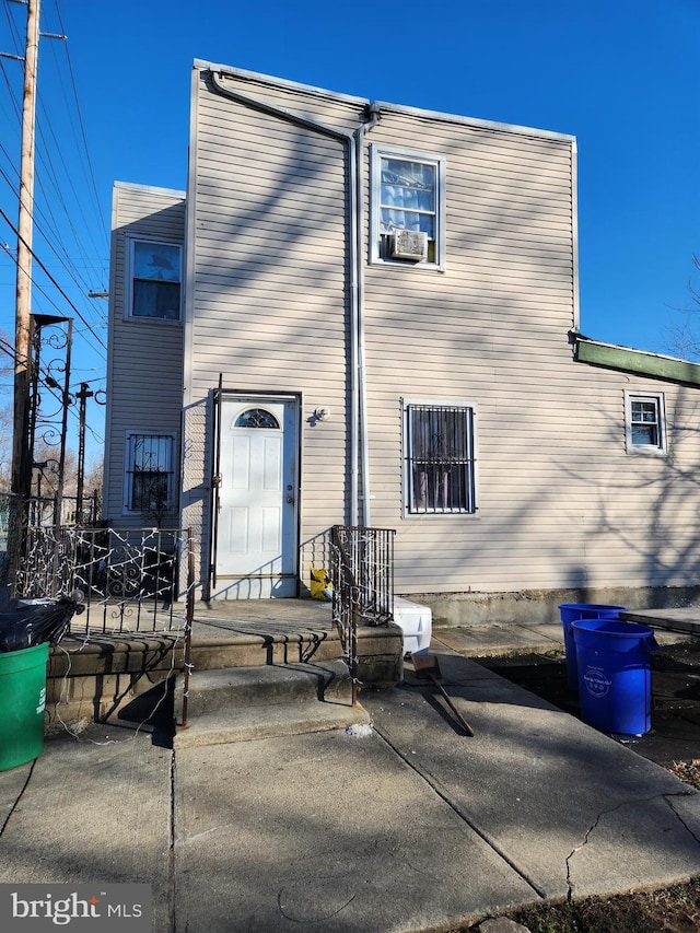 back of house featuring a patio area and cooling unit