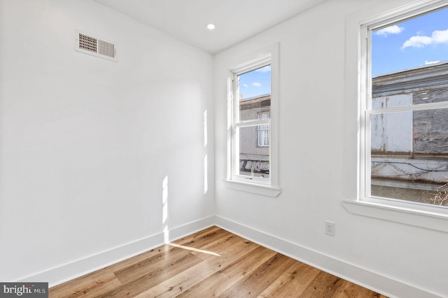 spare room featuring hardwood / wood-style floors