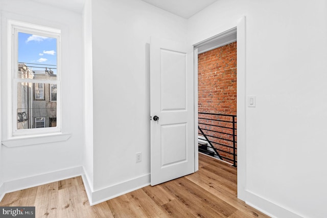 hall with light wood-type flooring