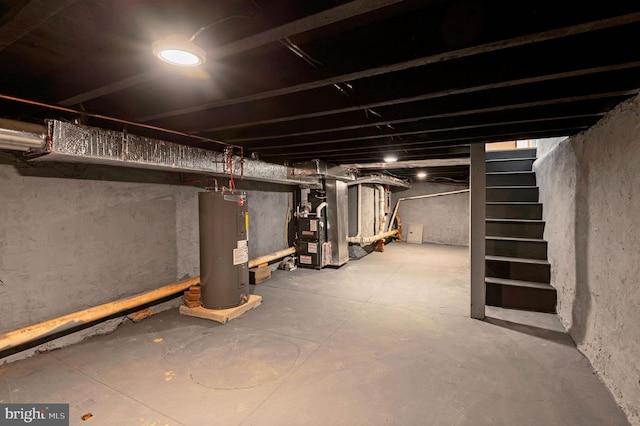 basement featuring electric water heater and heating unit