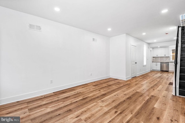 unfurnished living room featuring light hardwood / wood-style floors