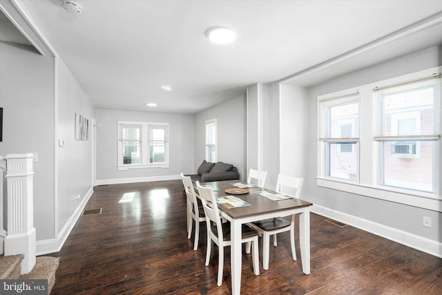 dining area with dark hardwood / wood-style floors