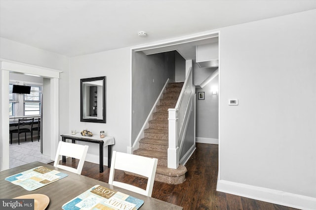 staircase with wood-type flooring