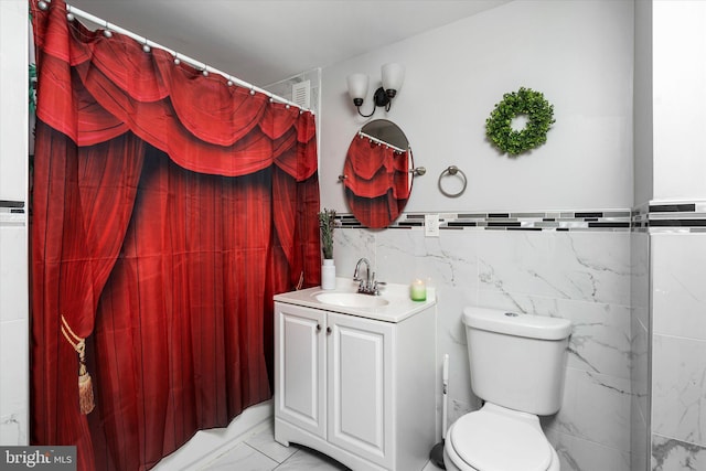 bathroom featuring vanity, tile walls, a shower with shower curtain, and toilet