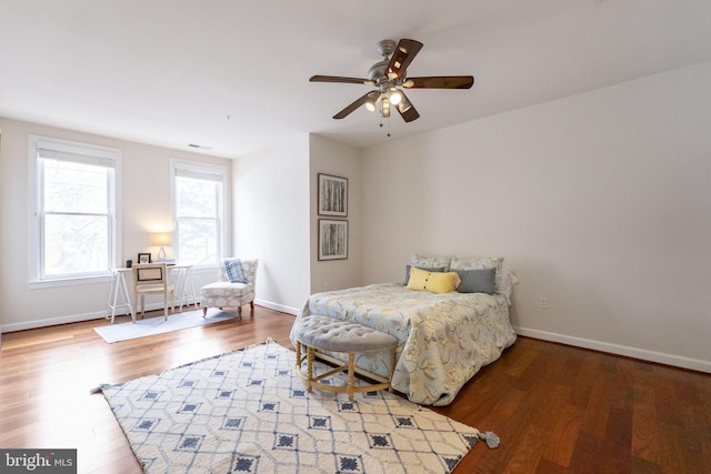 bedroom with ceiling fan and hardwood / wood-style flooring