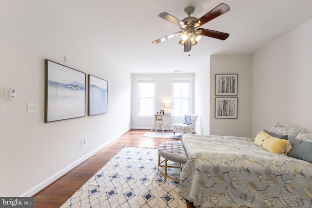 bedroom with hardwood / wood-style flooring and ceiling fan