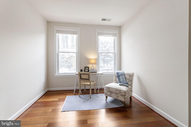 sitting room featuring hardwood / wood-style floors