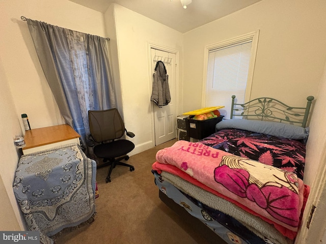 carpeted bedroom featuring a closet