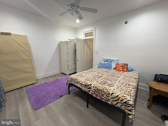 bedroom with ceiling fan and light hardwood / wood-style floors