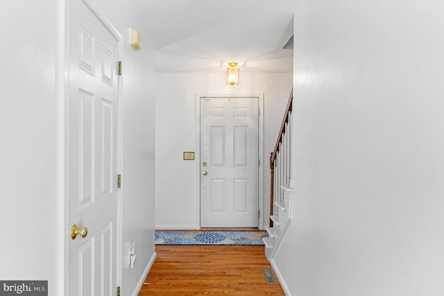 entryway with light hardwood / wood-style floors