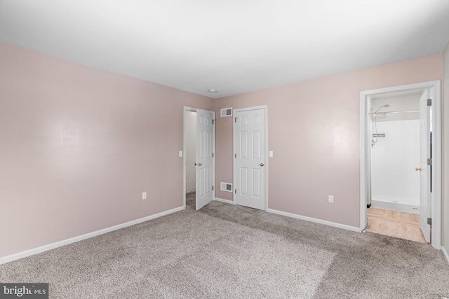 unfurnished bedroom featuring carpet