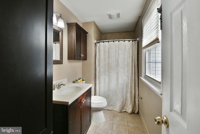 bathroom featuring tile patterned flooring, vanity, a shower with curtain, and toilet