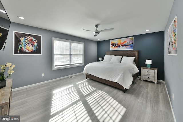 bedroom featuring ceiling fan and hardwood / wood-style floors