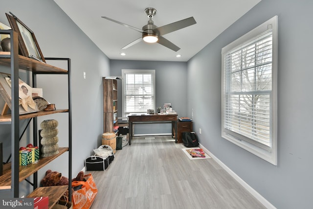 miscellaneous room with hardwood / wood-style floors and ceiling fan