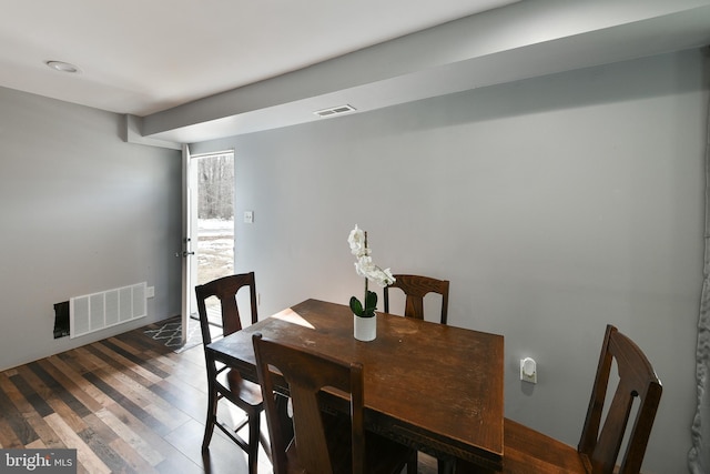 dining room with dark hardwood / wood-style floors