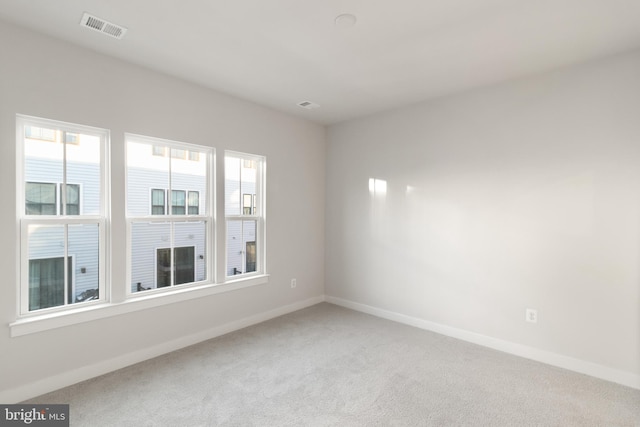 unfurnished room with carpet flooring