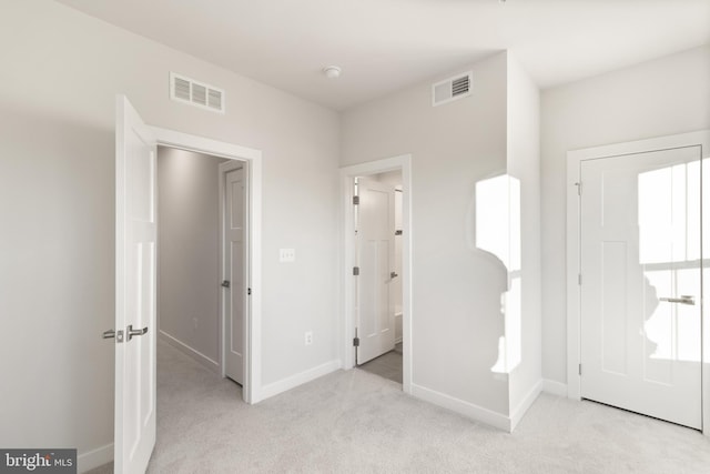 entrance foyer featuring light carpet