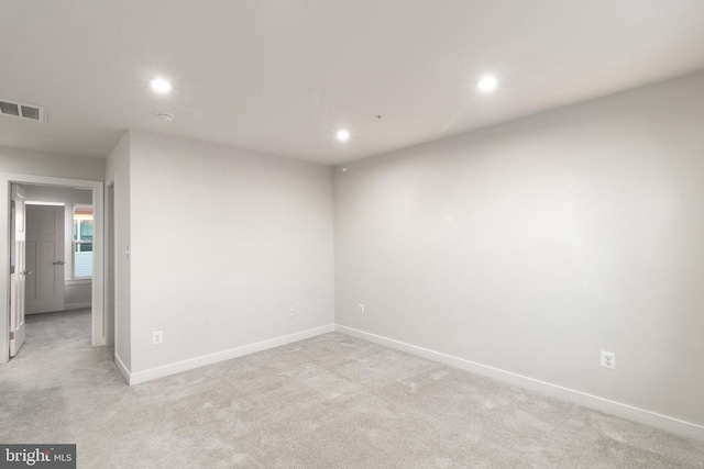 spare room with light colored carpet