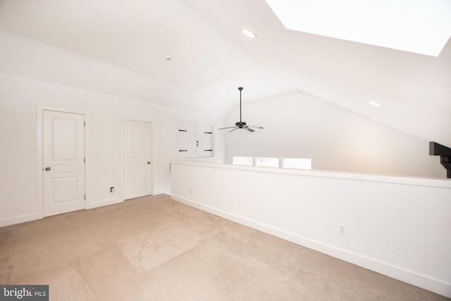 bonus room featuring ceiling fan, light colored carpet, and vaulted ceiling