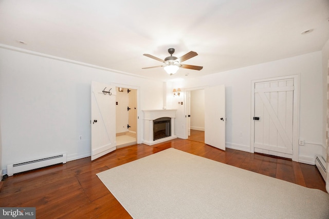 unfurnished living room featuring ceiling fan, a baseboard radiator, and dark hardwood / wood-style floors