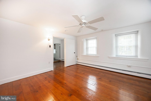 empty room with ceiling fan, hardwood / wood-style flooring, and a baseboard radiator