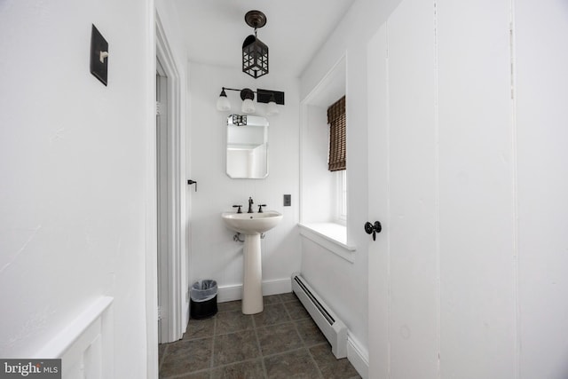 bathroom featuring baseboard heating