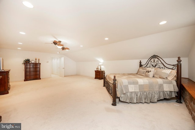 carpeted bedroom featuring ceiling fan and lofted ceiling