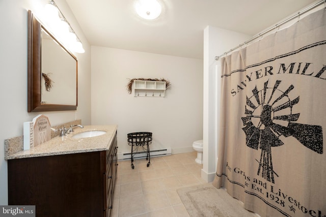 bathroom with baseboard heating, toilet, vanity, and tile patterned flooring