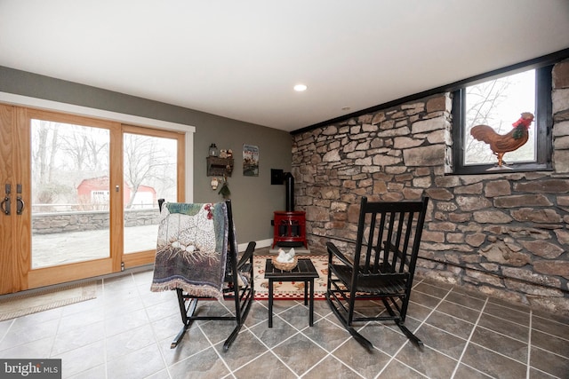 living area featuring a wood stove