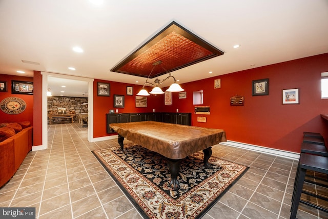 recreation room featuring pool table and a fireplace