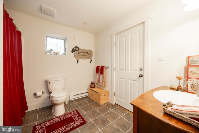 bathroom with toilet, vanity, tile patterned flooring, and a baseboard radiator