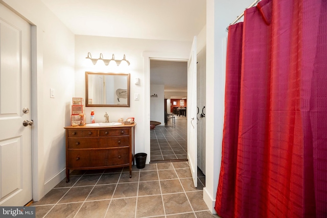 bathroom featuring tile patterned floors and vanity