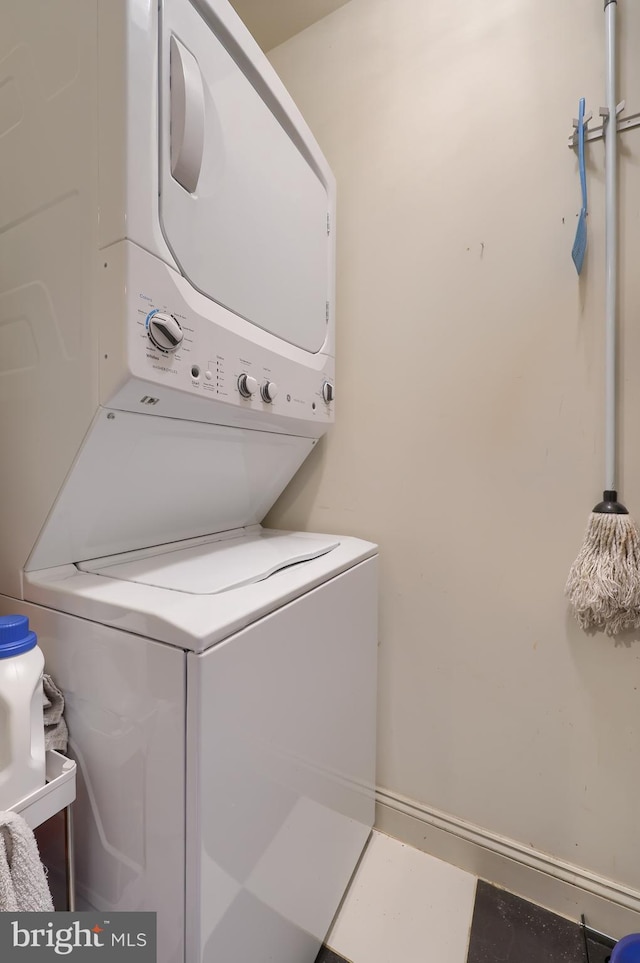 laundry area with laundry area and stacked washing maching and dryer