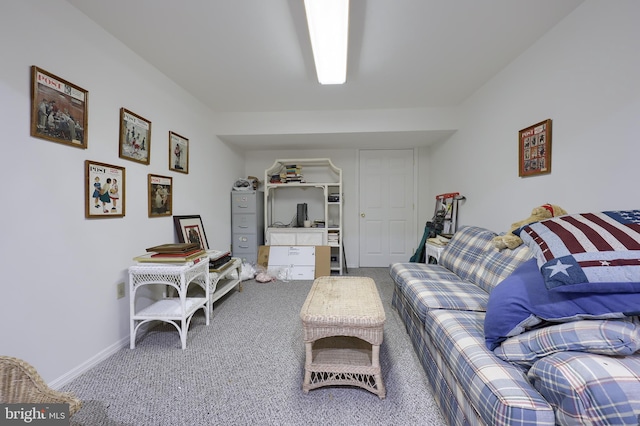 living room featuring carpet flooring and baseboards