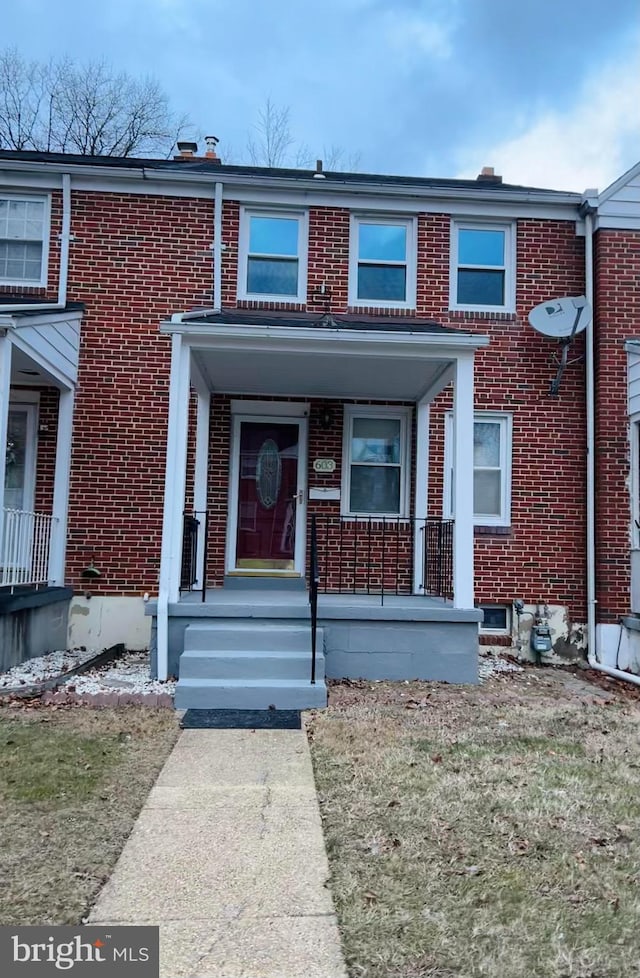 view of property with a porch