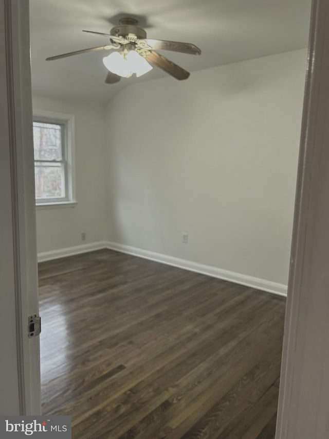 unfurnished room with ceiling fan and dark hardwood / wood-style floors