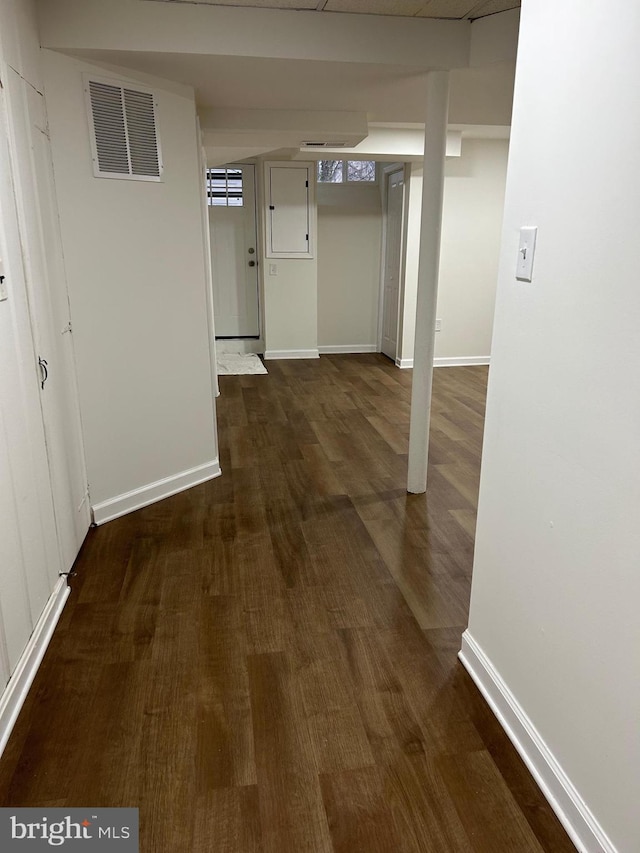 corridor featuring dark hardwood / wood-style floors