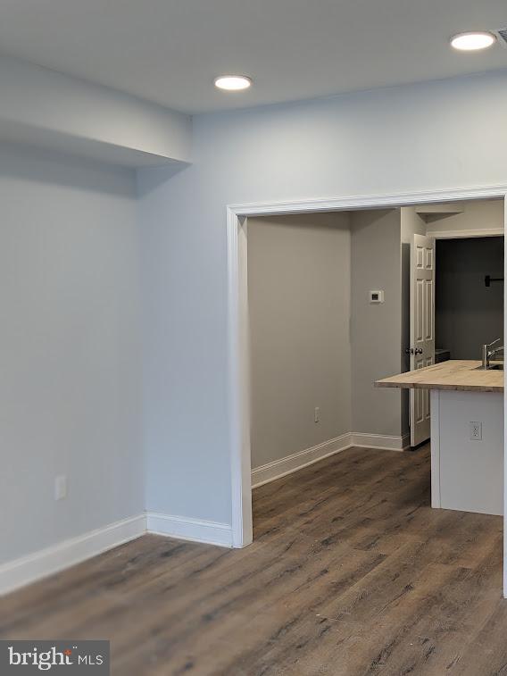 interior space with dark wood-type flooring