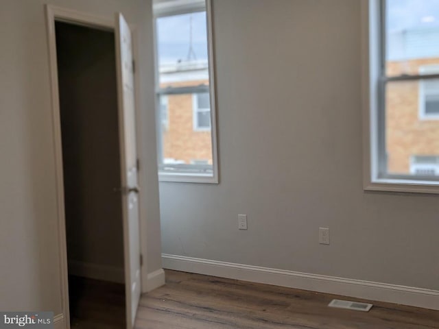 spare room featuring hardwood / wood-style floors