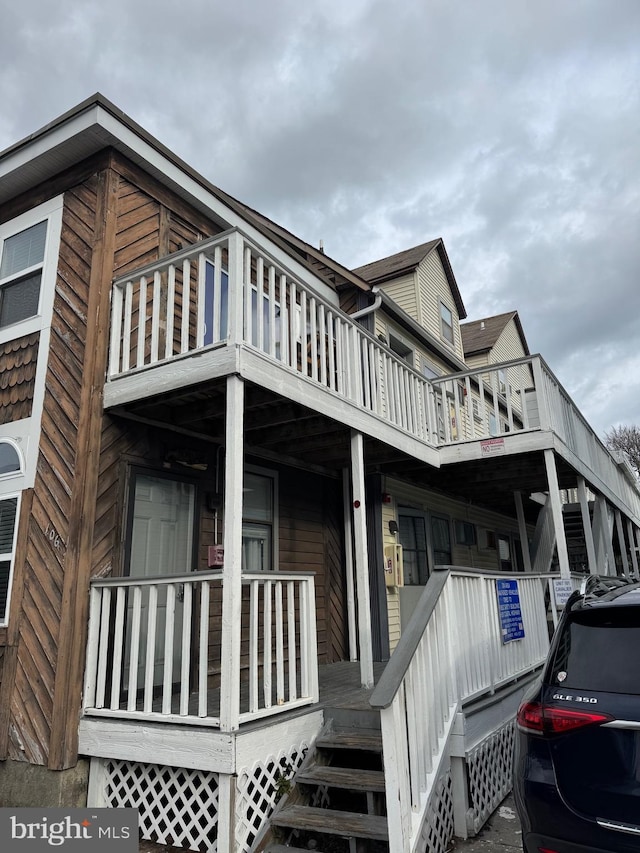 view of side of home with a balcony