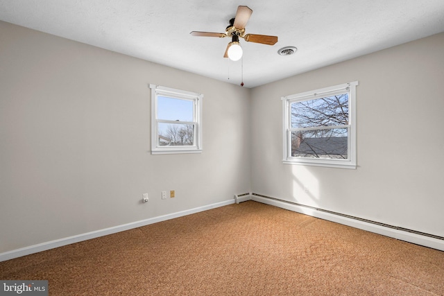 empty room featuring ceiling fan, carpet floors, and baseboard heating