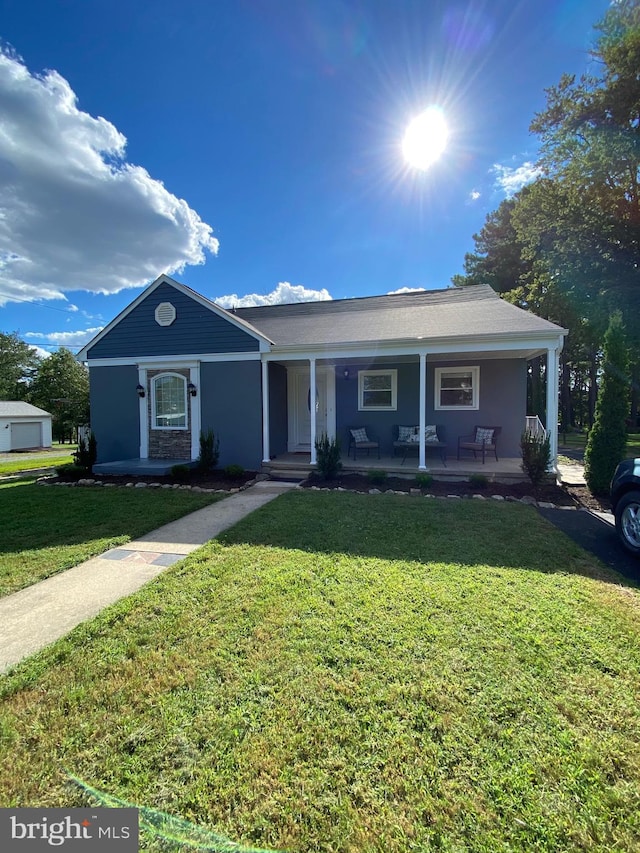 view of front of property with a front lawn and a porch