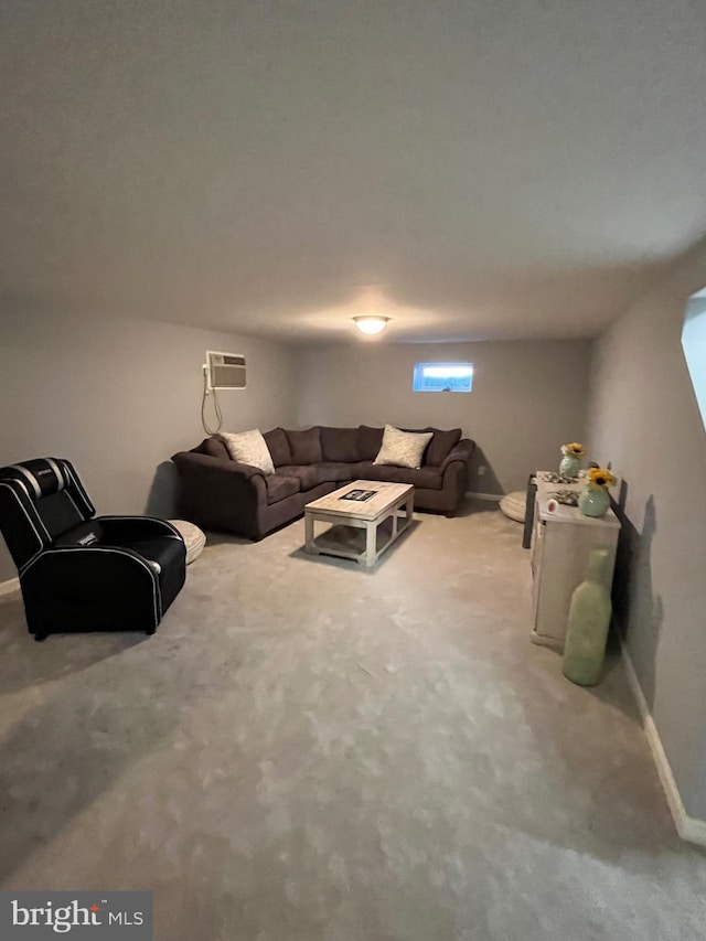 carpeted living room featuring a wall unit AC