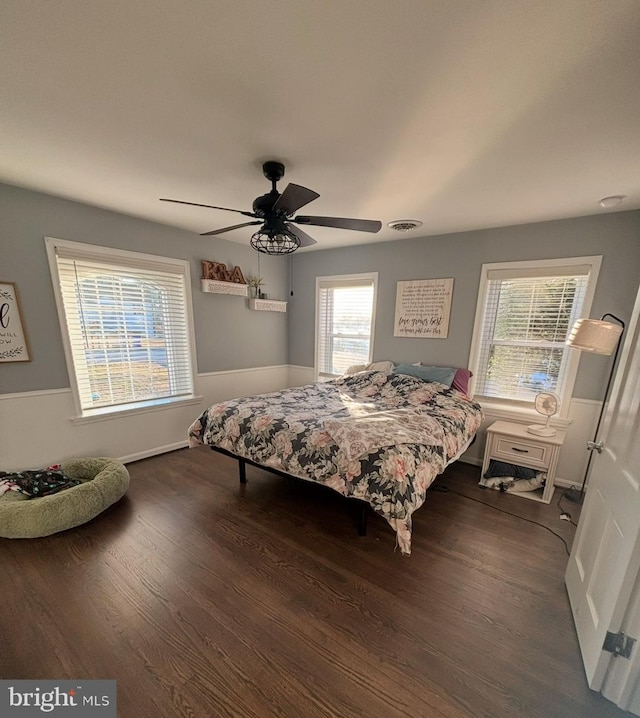 bedroom featuring dark hardwood / wood-style flooring and ceiling fan