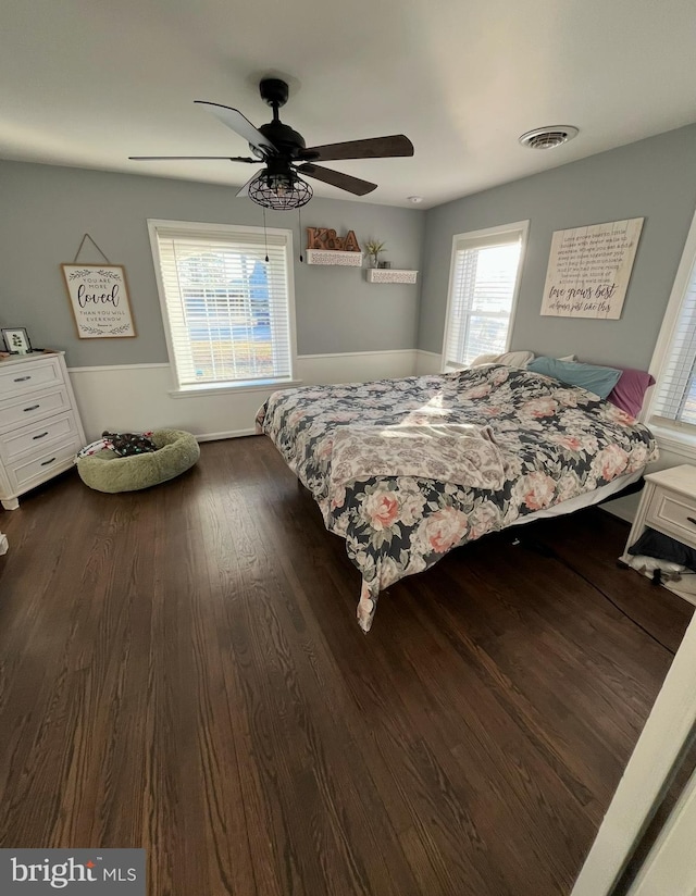 bedroom featuring ceiling fan and dark hardwood / wood-style flooring