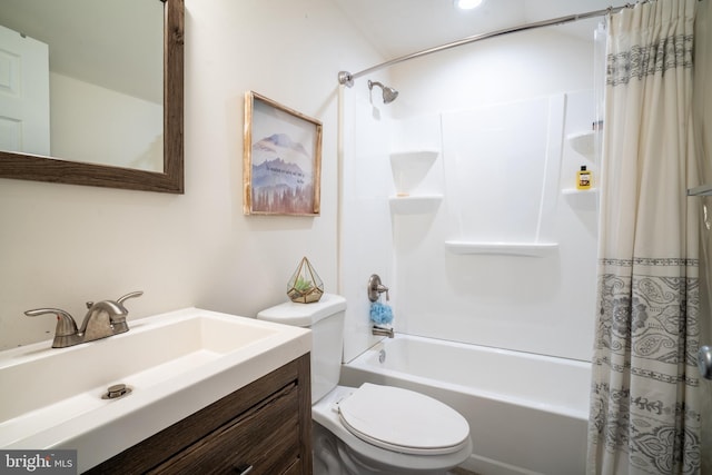 full bathroom featuring vanity, shower / bath combo, and toilet