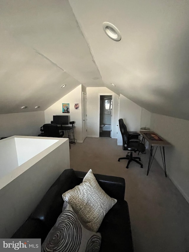 office space with lofted ceiling and carpet floors